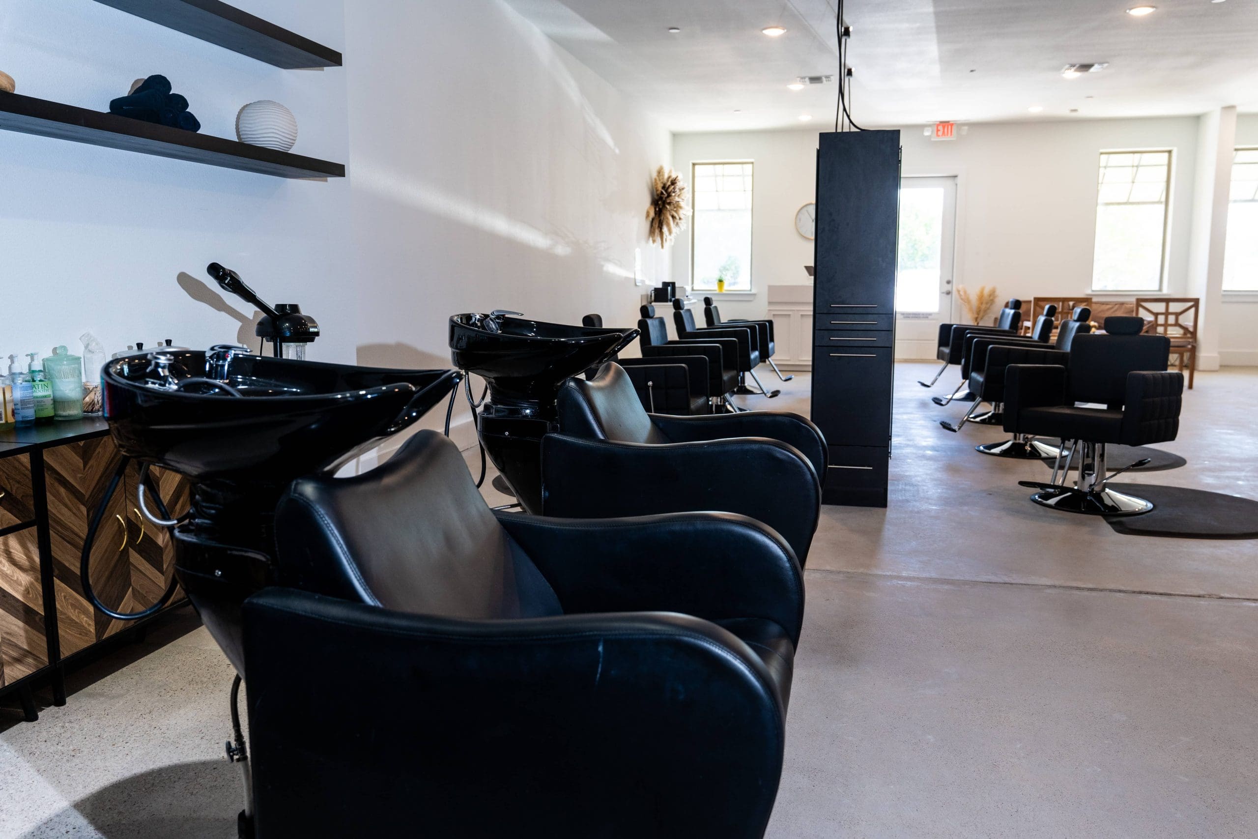 Shampoo bowls with black reclining chairs